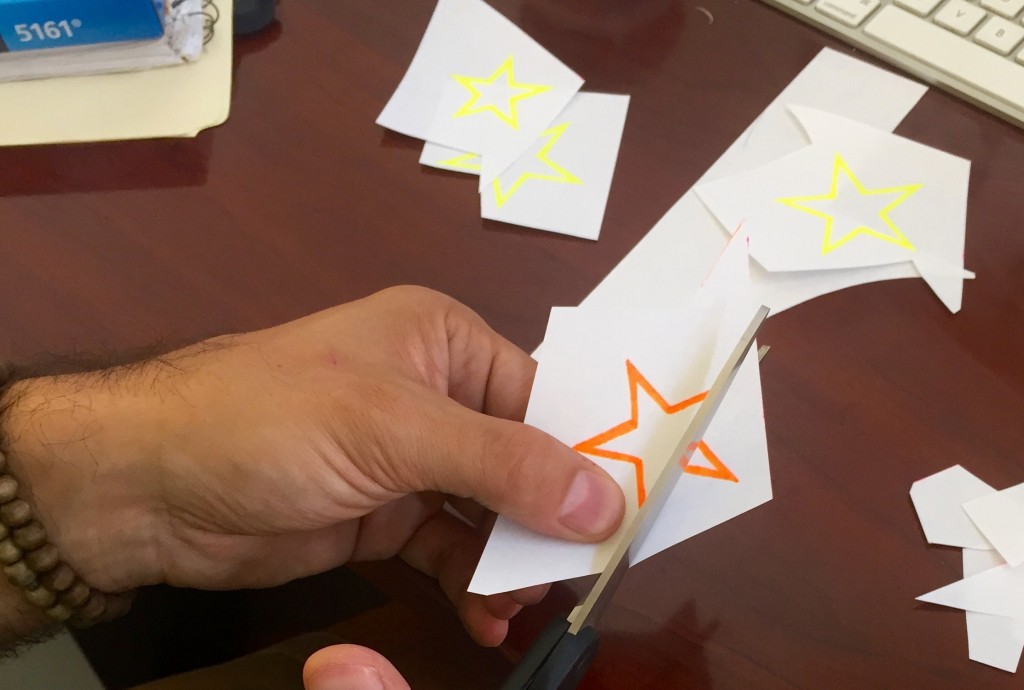Cutting up. These stars look amazing in black light! Cutting Glow Stars